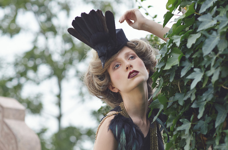 A model wearing a feathered headdress by Joanna Shears