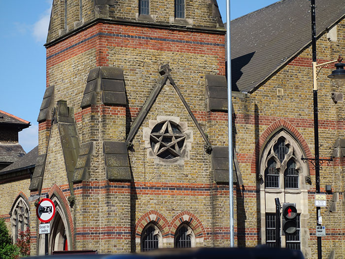 A pentagram on the exterior of St Barnabas at Bethnal Green