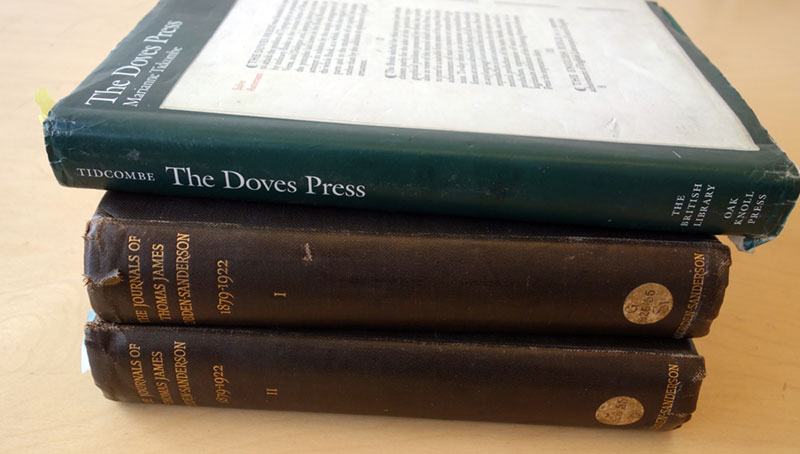 A stack of books about Doves Type and Thomas James Cobden-Sanderson