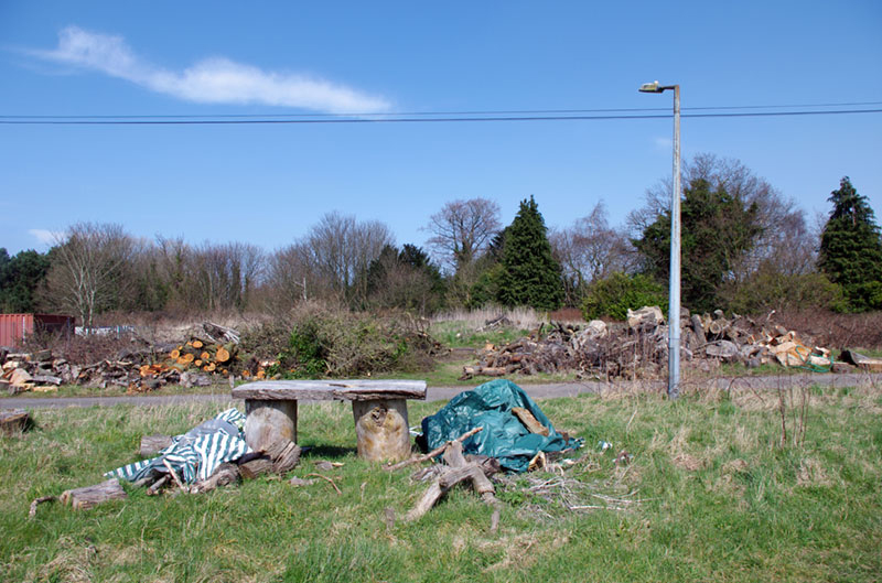 A workbench made from wood in the middle of a field