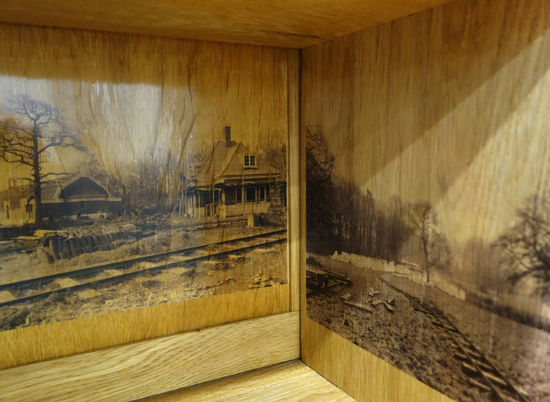 A close-up of the photograph - of trees - inside the bureau