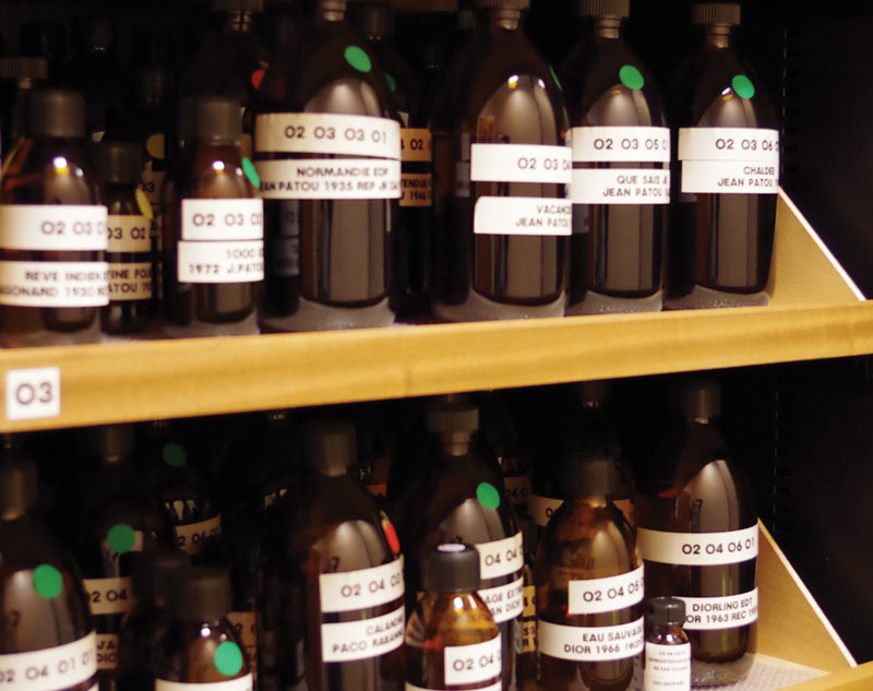 Shelves of brown bottles at Osmothèque in Paris