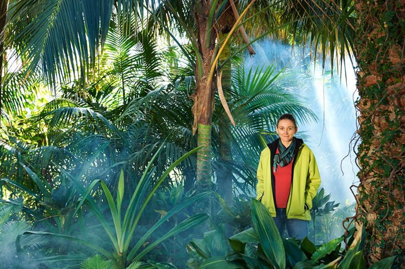 Portrait of Monica Gagliano standing in a misty rainforest