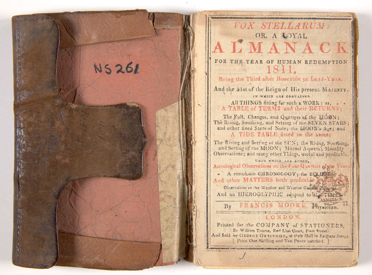 The inside page of a book with a brown leather cover