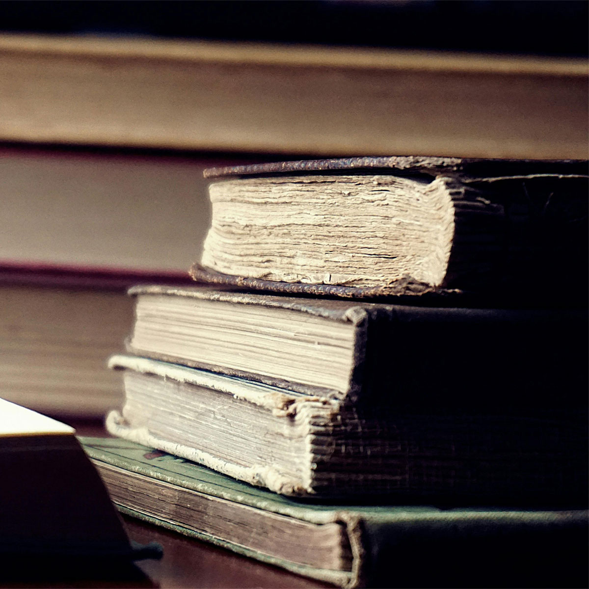 A stack of books on a desk