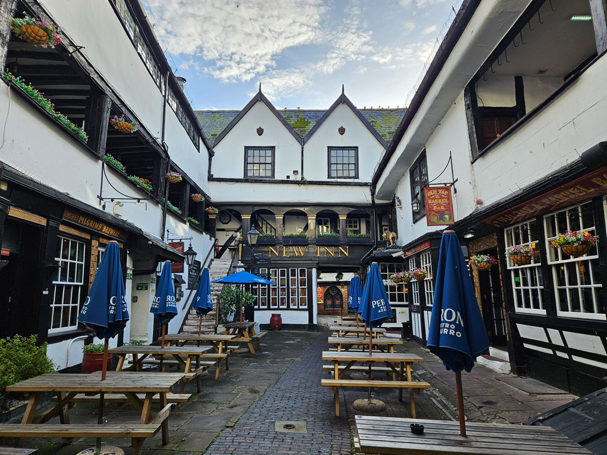 A view from the courtyard of a Tudor-style coaching in, looking up towards the galleries.