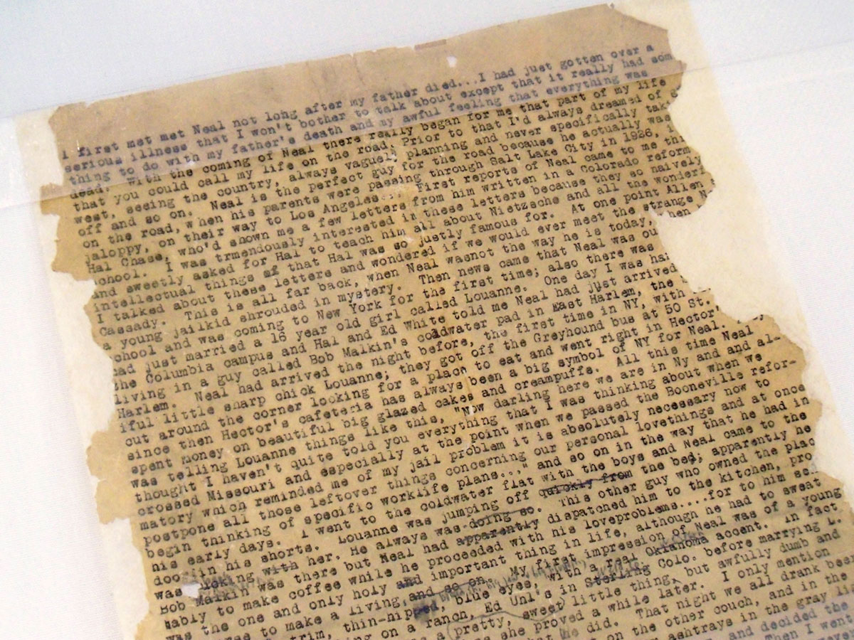 A type-written manuscript, brown with age and with some torn edges