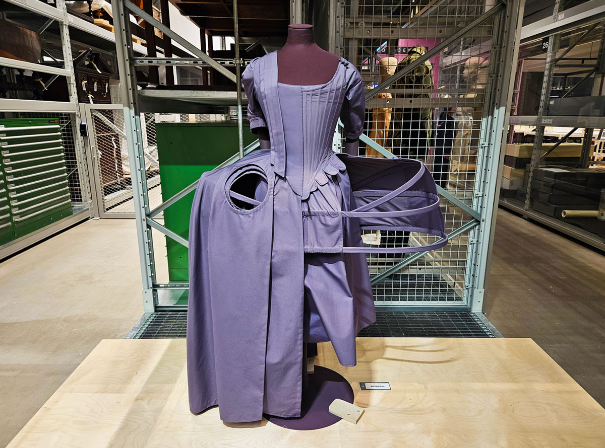 A mannequin wearing the under-garment support structure for an 18th Century dress